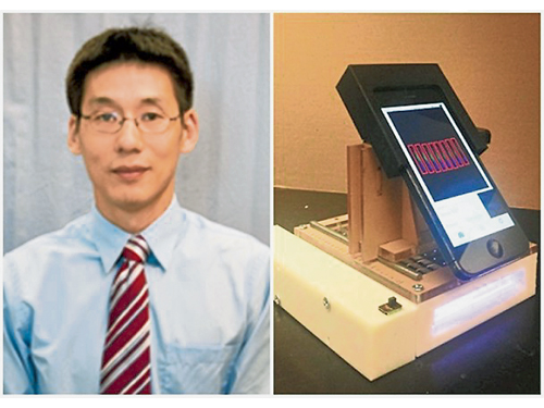 李雷（左）及其團隊研發可配合手機檢驗癌症的裝置。