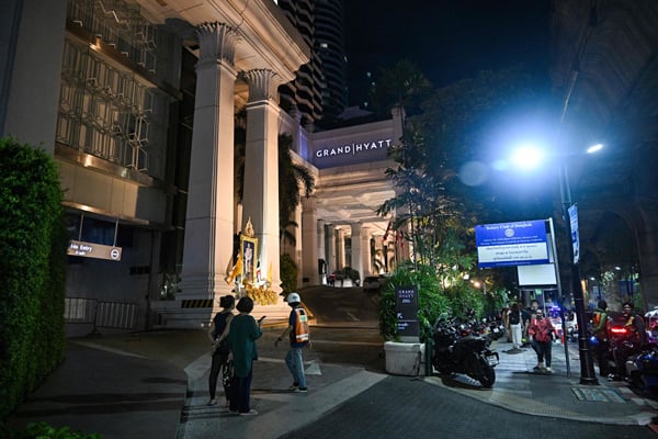 A general view of the street after an incident, in which six bodies were found at a hotel in Bangkok on July 16, 2024. (Photo by Lillian SUWANRUMPHA / AFP)