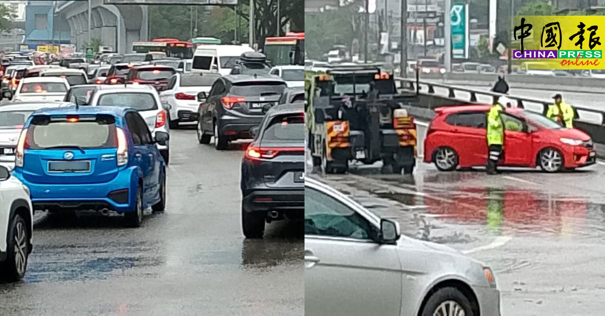 上班高峰期又下雨 5车困水中 引发大塞车